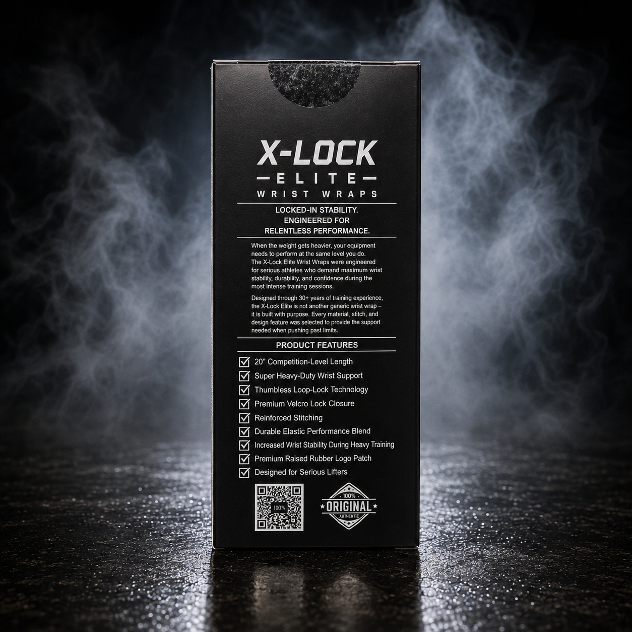 A tall black product box for X-LOCK ELITE wrist wraps stands upright on a dark reflective surface with smoky blue-white vapor rising behind it. The front of the box is black with white text detailing product features and branding.